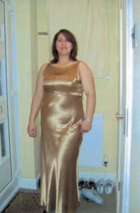 Heidi's before photo wearing a gold dress